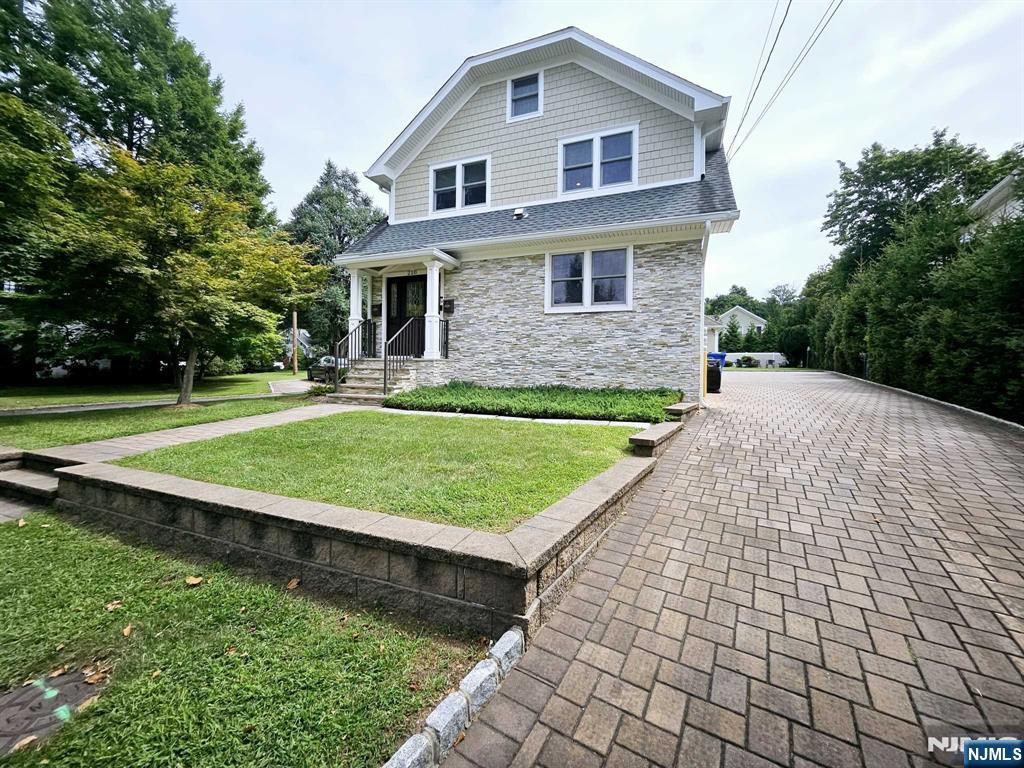 228 County Road, Unit 2 Tenafly, NJ 07670 - Photo 13 of 13 a view of a house with a yard and sitting area