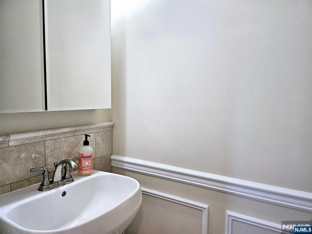 228 County Road, Unit 2 Tenafly, NJ 07670 - Photo 6 of 13 a bathroom with a sink and vanity