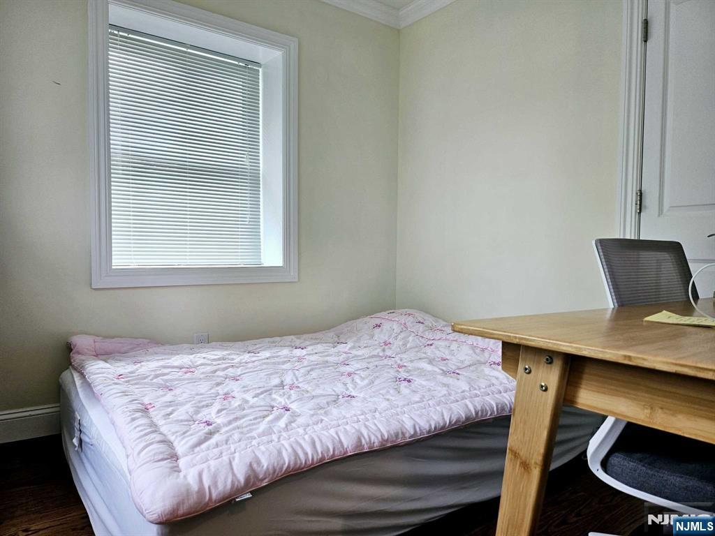 228 County Road, Unit 2 Tenafly, NJ 07670 - Photo 7 of 13 a bedroom with a bed window and table