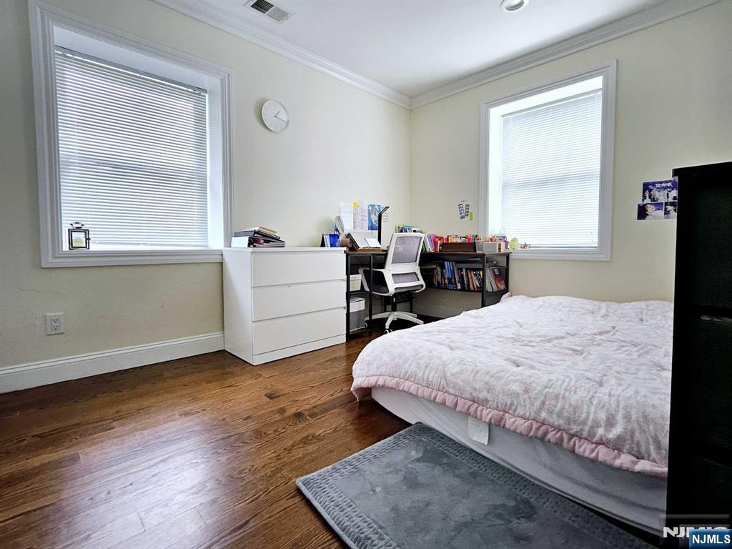 228 County Road, Unit 2 Tenafly, NJ 07670 - Photo 8 of 13 a bedroom with a bed and wooden floor