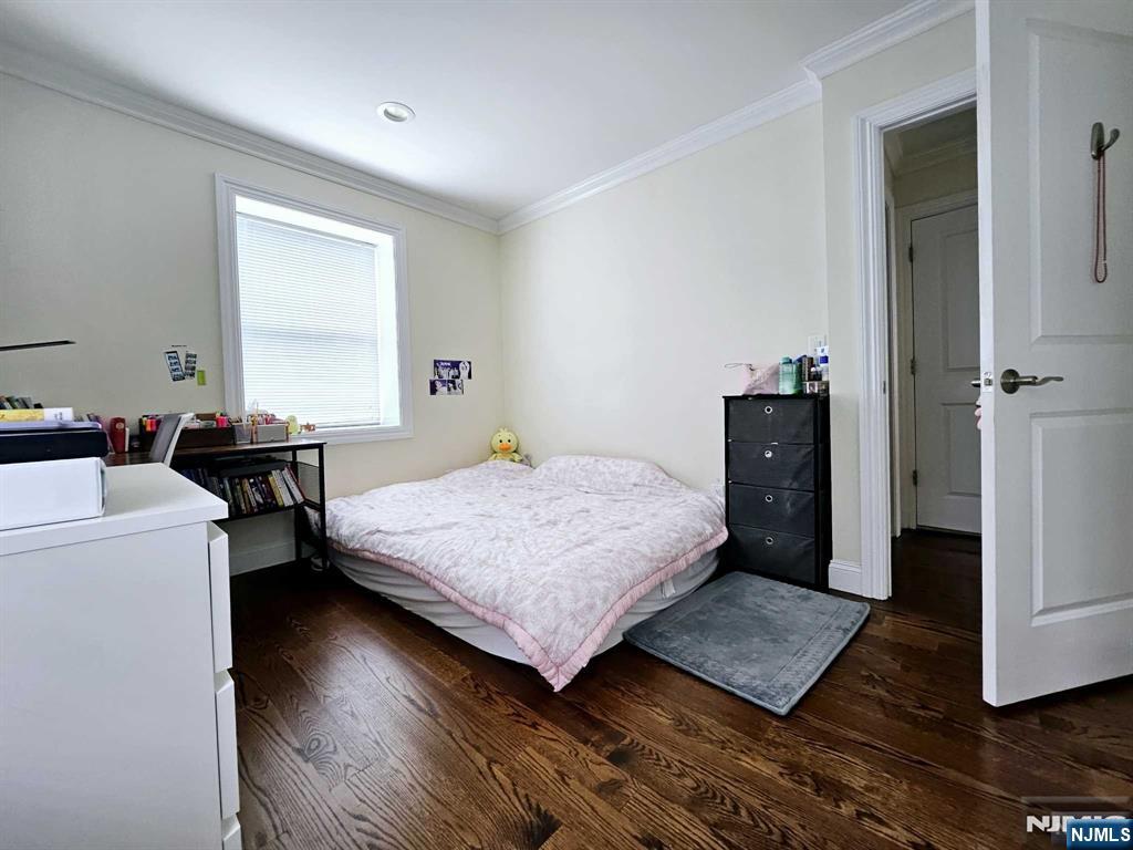 228 County Road, Unit 2 Tenafly, NJ 07670 - Photo 9 of 13 a bedroom with a bed and wooden floor