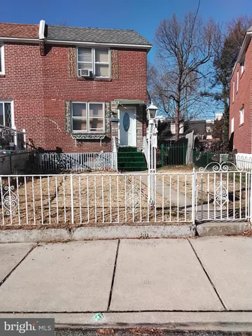 a view of a brick building with many windows