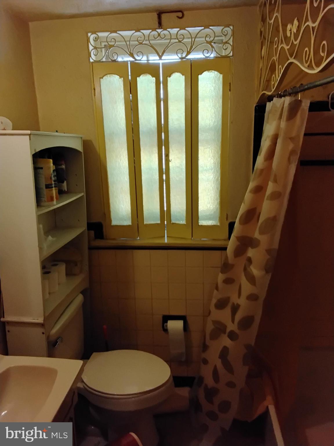 27 Concord Road Darby, PA 19023 - Photo 11 of 14 a bathroom with a toilet and a shower