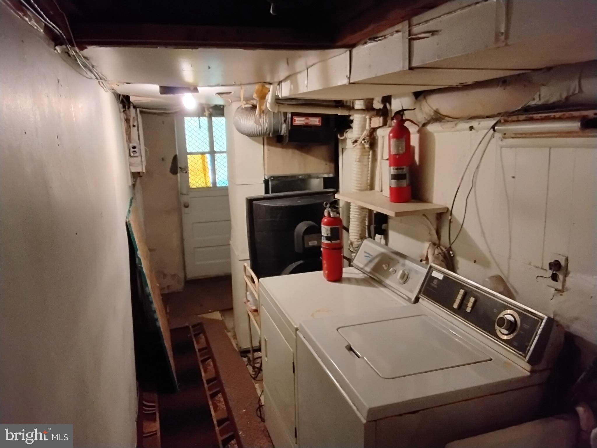 27 Concord Road Darby, PA 19023 - Photo 13 of 14 a utility room with dryer and washer