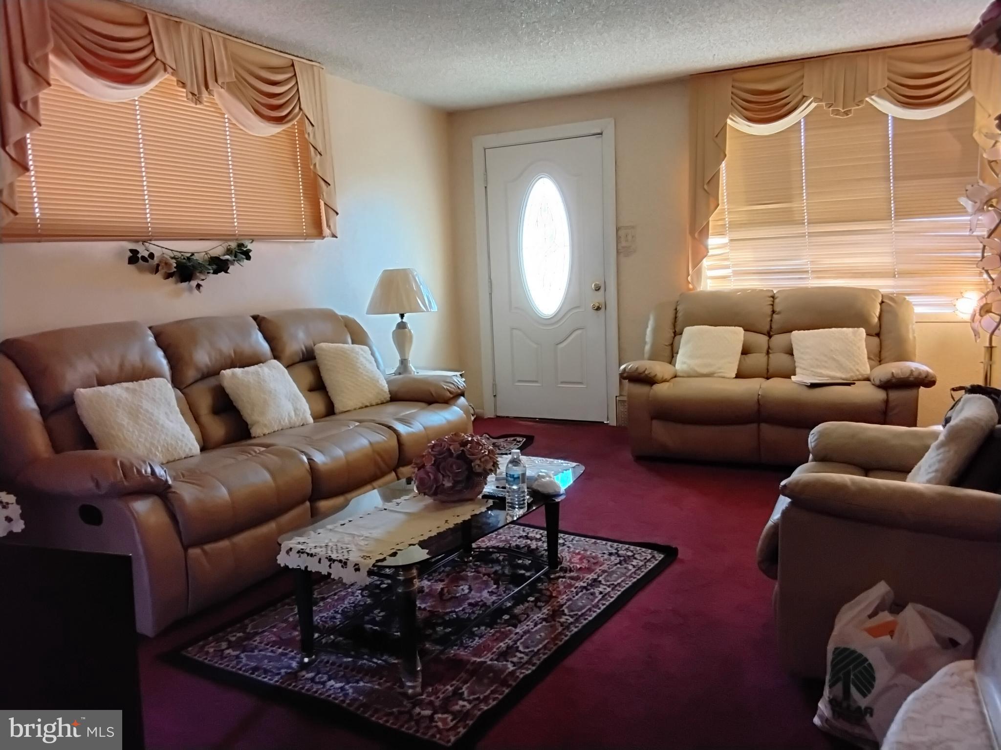 27 Concord Road Darby, PA 19023 - Photo 2 of 14 a living room with furniture lamp and a window