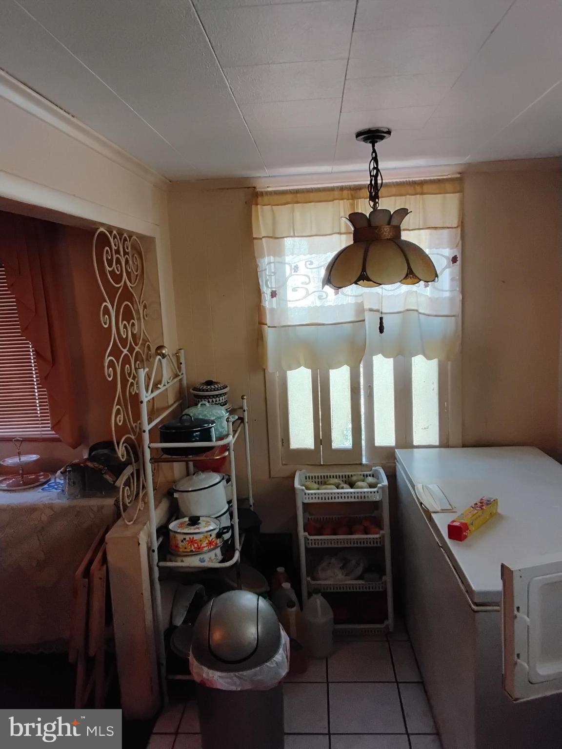 27 Concord Road Darby, PA 19023 - Photo 5 of 14 a kitchen with stainless steel appliances granite countertop a stove and a refrigerator