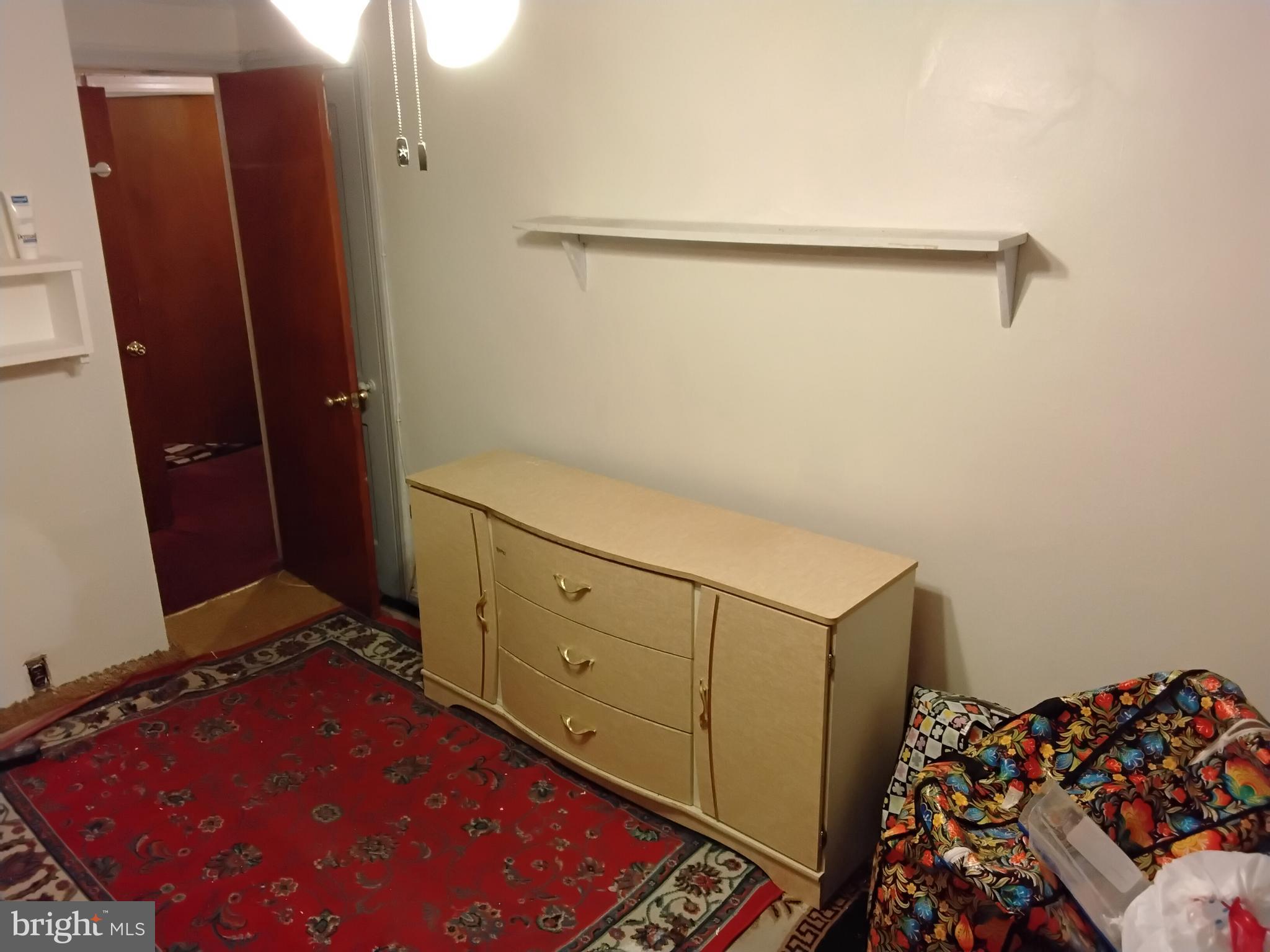 27 Concord Road Darby, PA 19023 - Photo 9 of 14 a room with cabinets and wooden floor