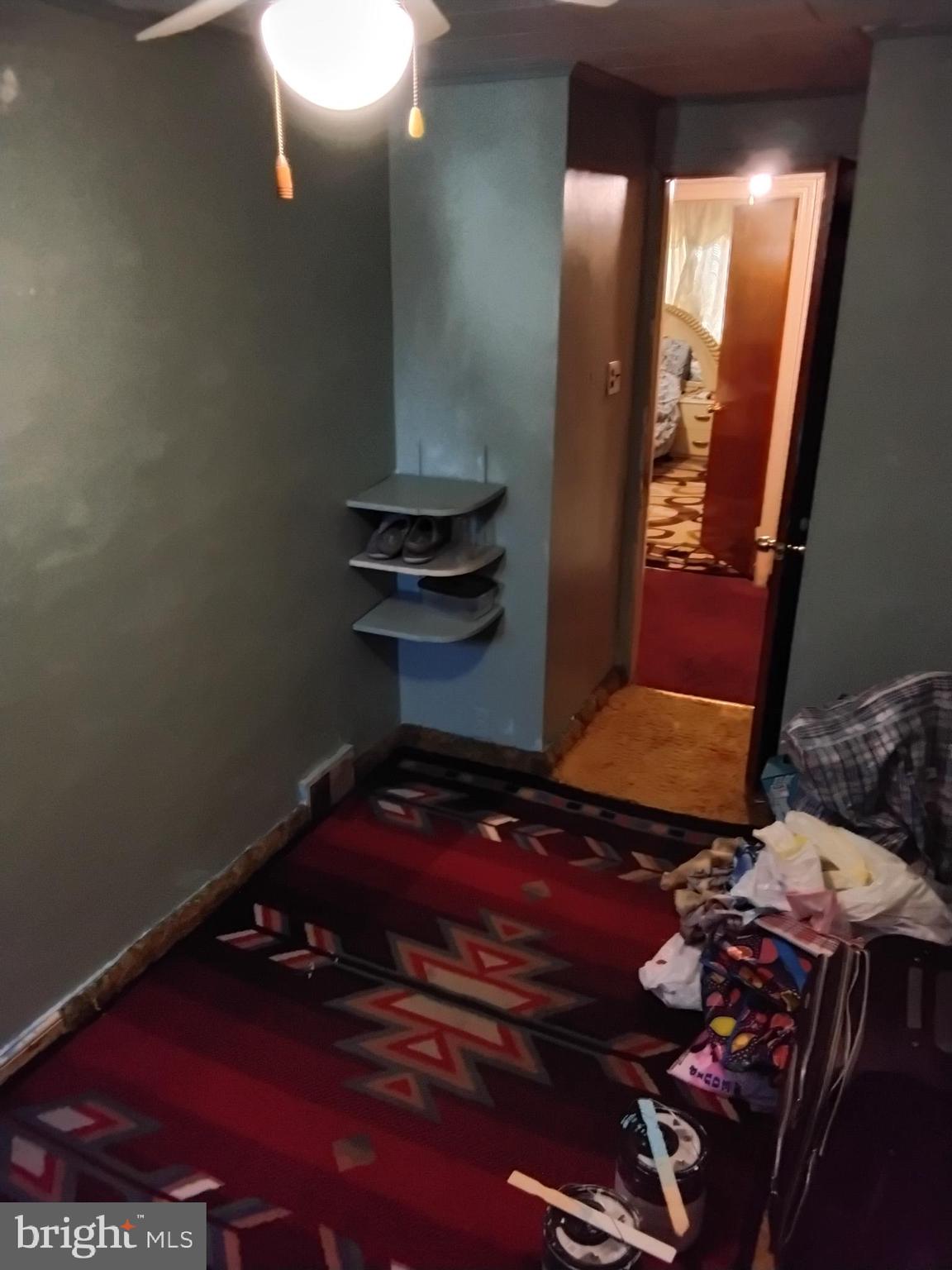 27 Concord Road Darby, PA 19023 - Photo 10 of 14 a room with water heater and wooden floor