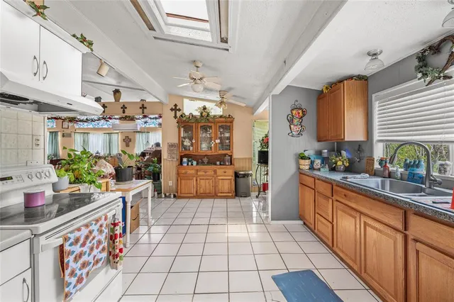 a kitchen with stainless steel appliances kitchen island granite countertop lots of counter top space