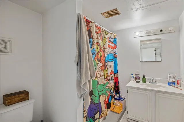 a utility room with fridge dryer and washer