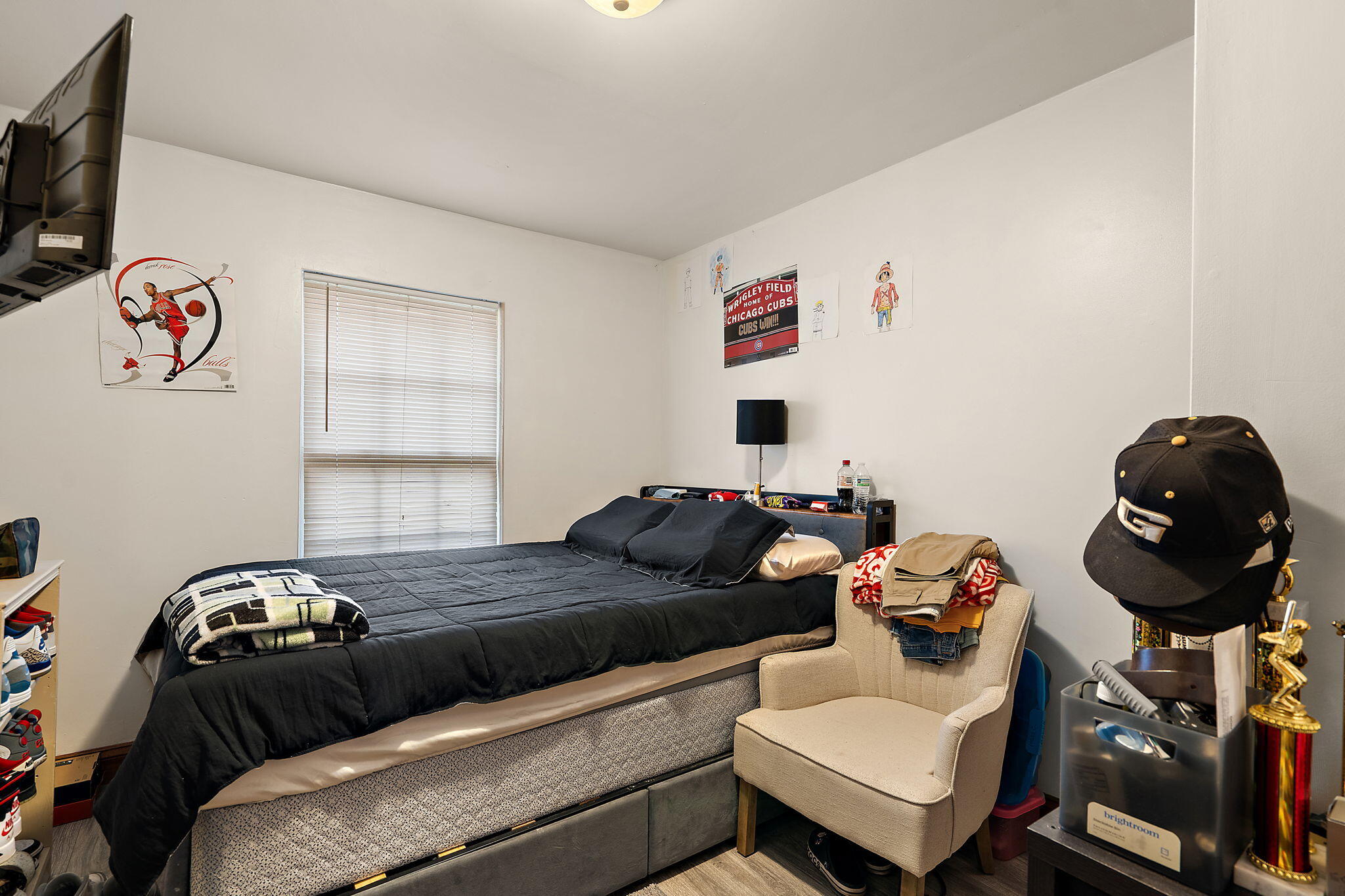 706 North Colfax Street Griffith, IN 46319 - Photo 13 of 25 a bedroom with a bed and a window