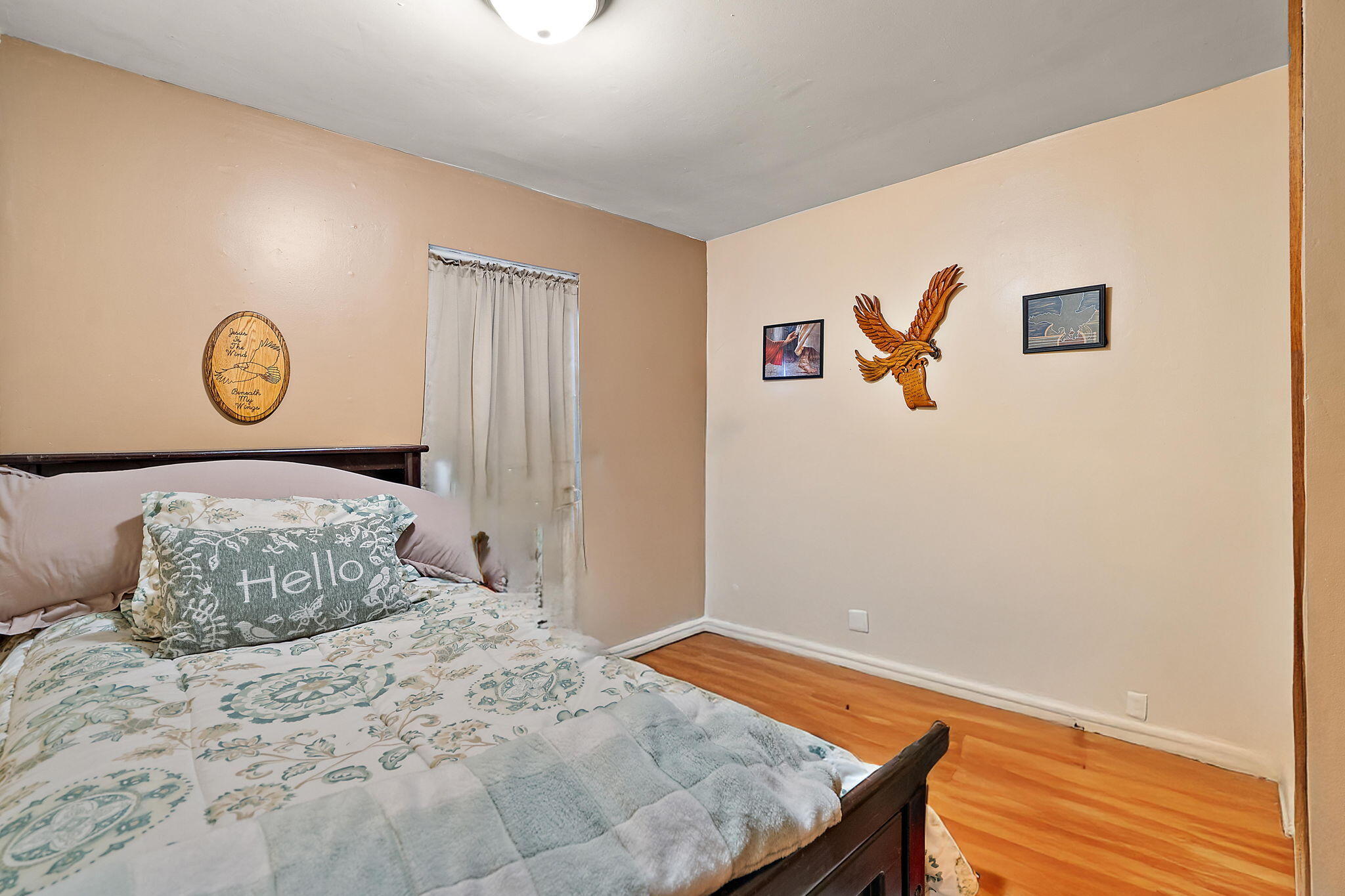 706 North Colfax Street Griffith, IN 46319 - Photo 14 of 25 a bedroom with a bed and a window