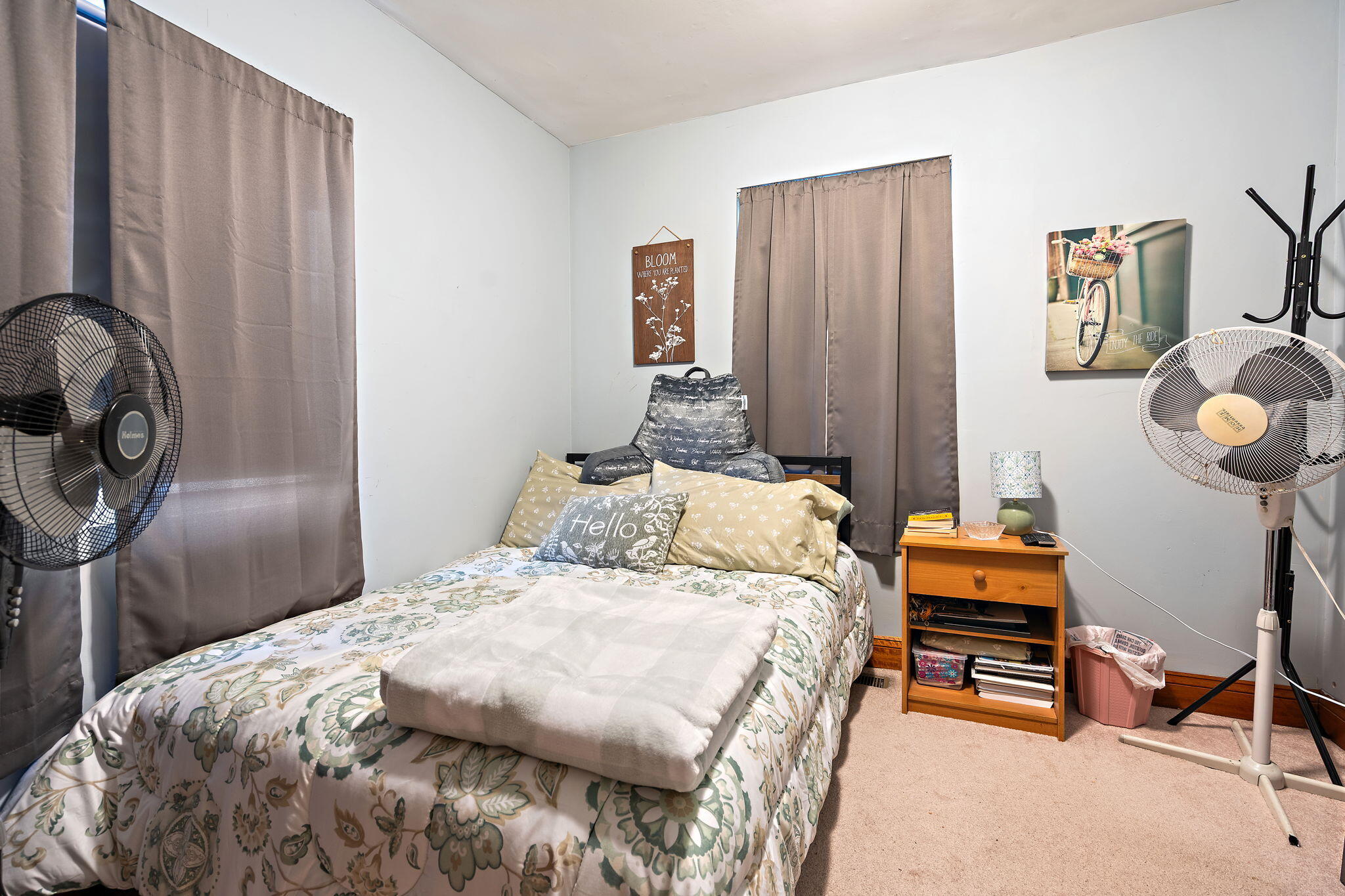 706 North Colfax Street Griffith, IN 46319 - Photo 15 of 25 a bedroom with a bed and a chandelier