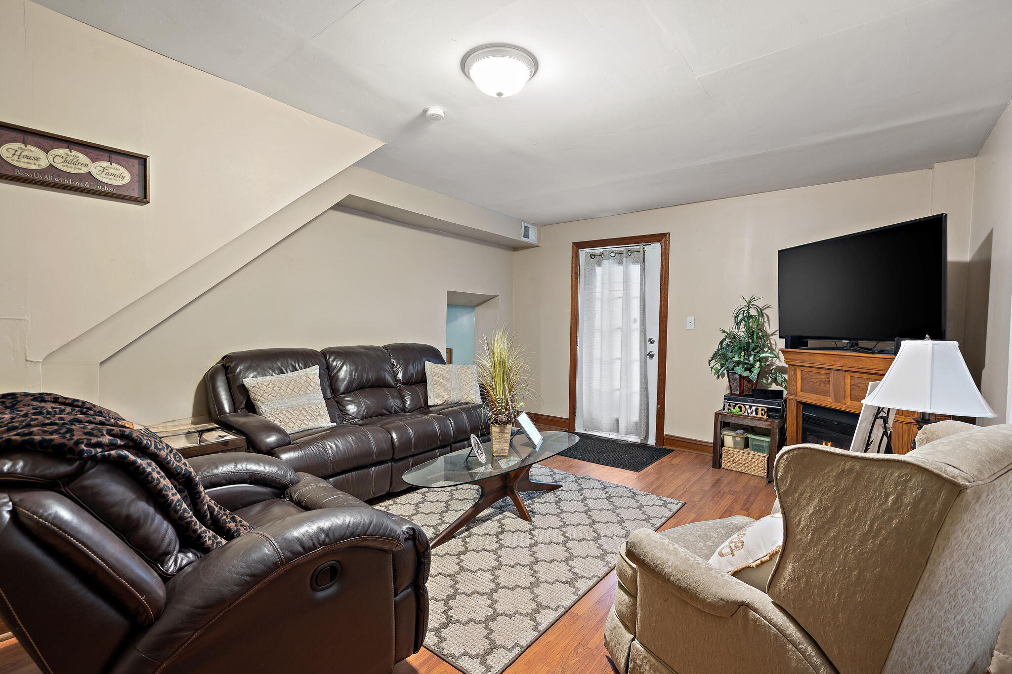 706 North Colfax Street Griffith, IN 46319 - Photo 17 of 25 a living room with furniture and a flat screen tv