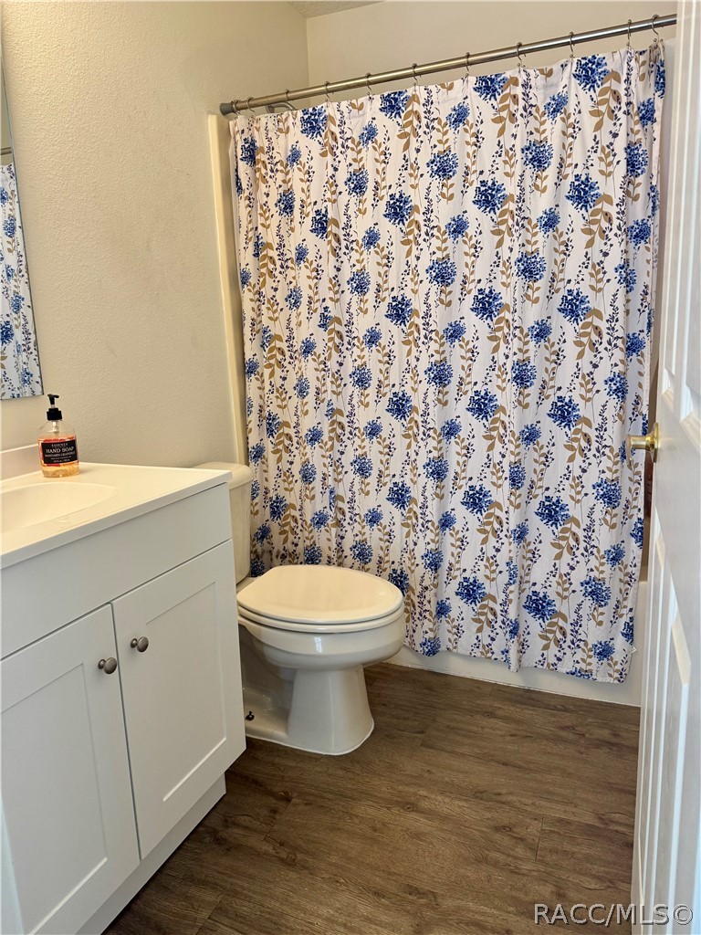 4588 East Van Ness Road Inverness, FL 34453 - Photo 27 of 34 a bathroom with a toilet and a sink