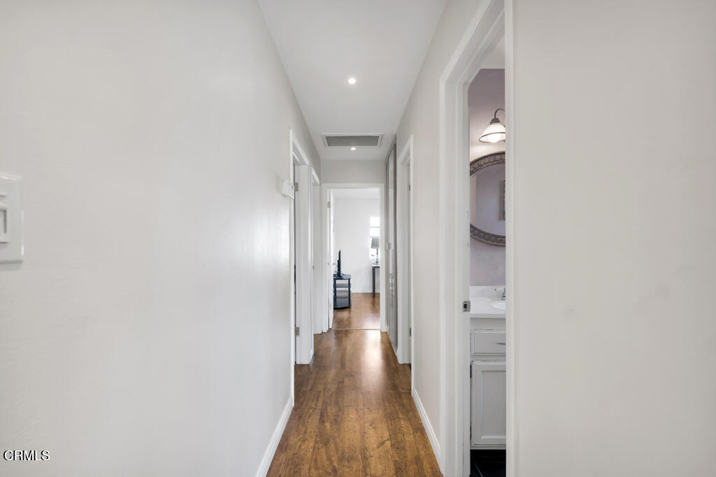 3151 Fournier Street Oxnard, CA 93033 - Photo 13 of 40 a view of a hallway with wooden floor