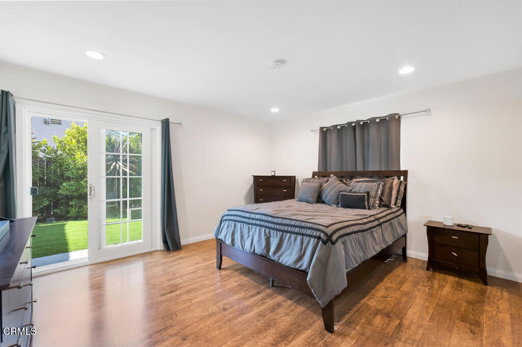 3151 Fournier Street Oxnard, CA 93033 - Photo 14 of 40 a spacious bedroom with a bed and a large window