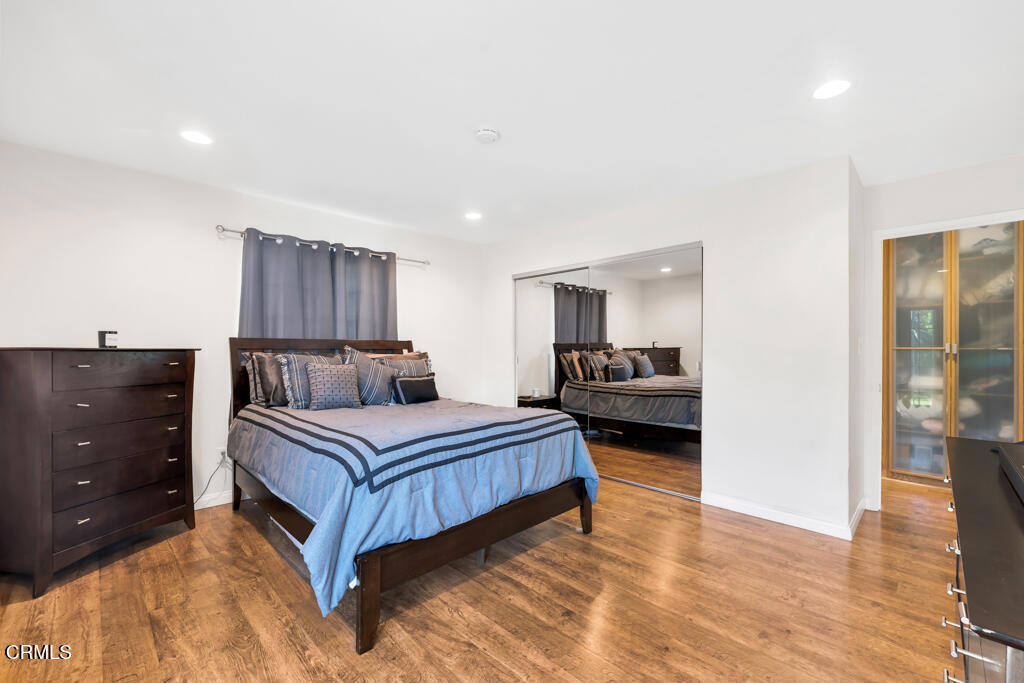 3151 Fournier Street Oxnard, CA 93033 - Photo 15 of 40 a bedroom with a bed and a view of kitchen