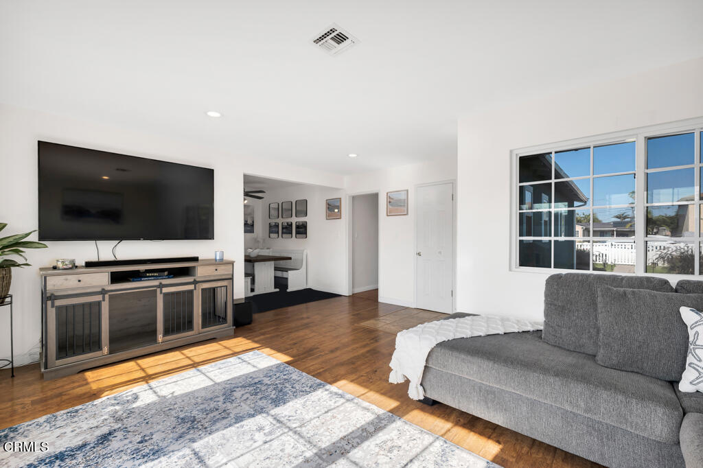 3151 Fournier Street Oxnard, CA 93033 - Photo 7 of 40 a living room with furniture and a flat screen tv