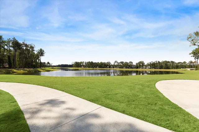 a view of a golf course with a lake