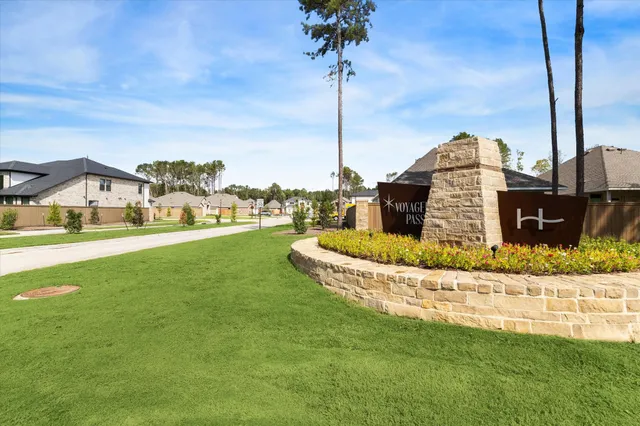 a view of a house with a big yard and potted plants