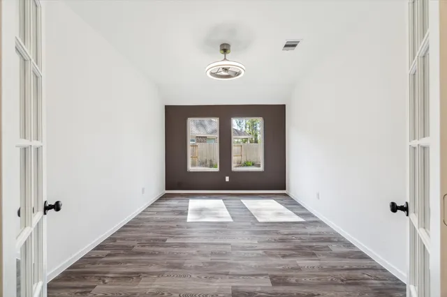 a view of an empty room with a window