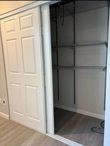 an empty room with wooden floor