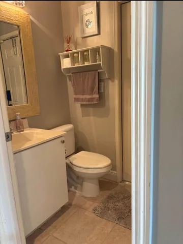 a bathroom with a toilet and a sink