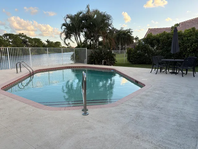 a view of a swimming pool with a lake view