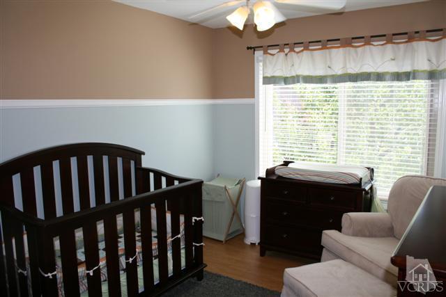 1706 Sinaloa Road, Unit 208 Simi Valley, CA 93065 - Photo 13 of 21 a bedroom with furniture and a window