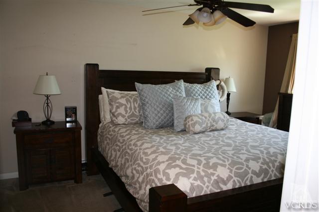 1706 Sinaloa Road, Unit 208 Simi Valley, CA 93065 - Photo 15 of 21 a large bed sitting in a bedroom next to a window