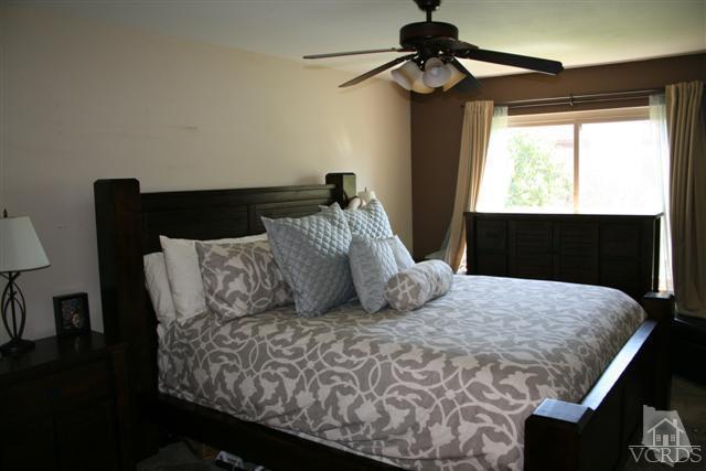 1706 Sinaloa Road, Unit 208 Simi Valley, CA 93065 - Photo 16 of 21 a bedroom with a bed and a window