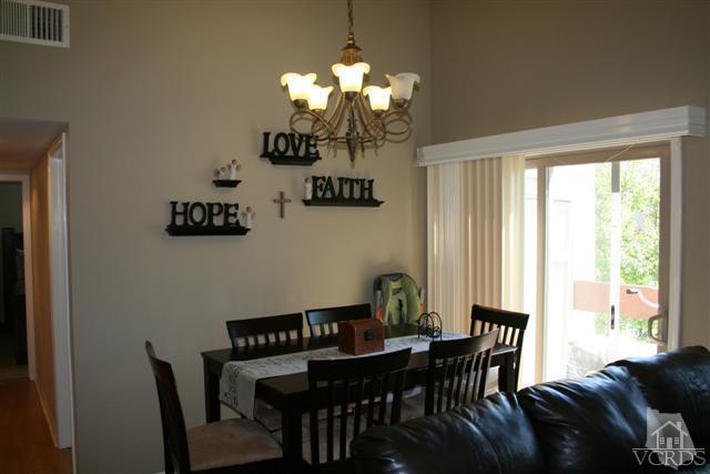 1706 Sinaloa Road, Unit 208 Simi Valley, CA 93065 - Photo 6 of 21 a view of a dining room with furniture and chandelier