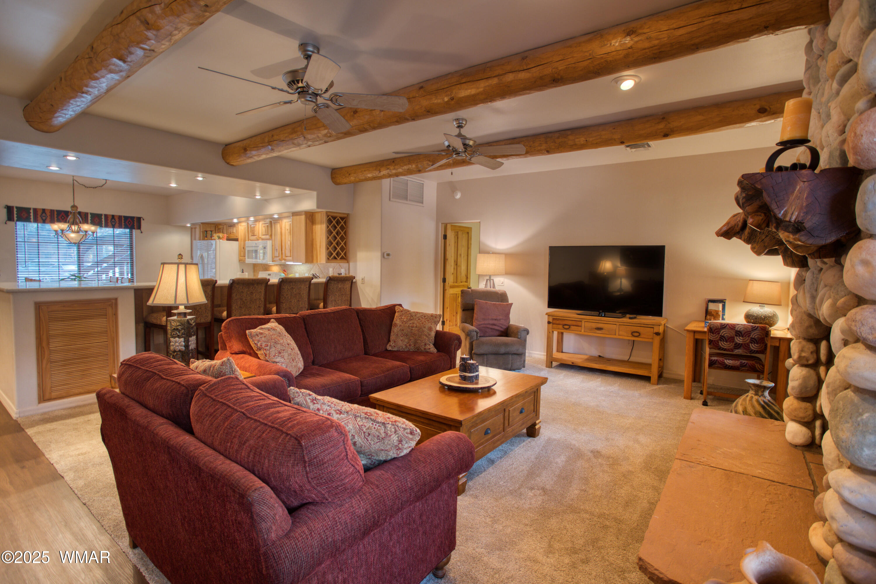 2566 Village Loop, Unit 19 Pinetop, AZ 85935 - Photo 4 of 30 a living room with furniture and a flat screen tv