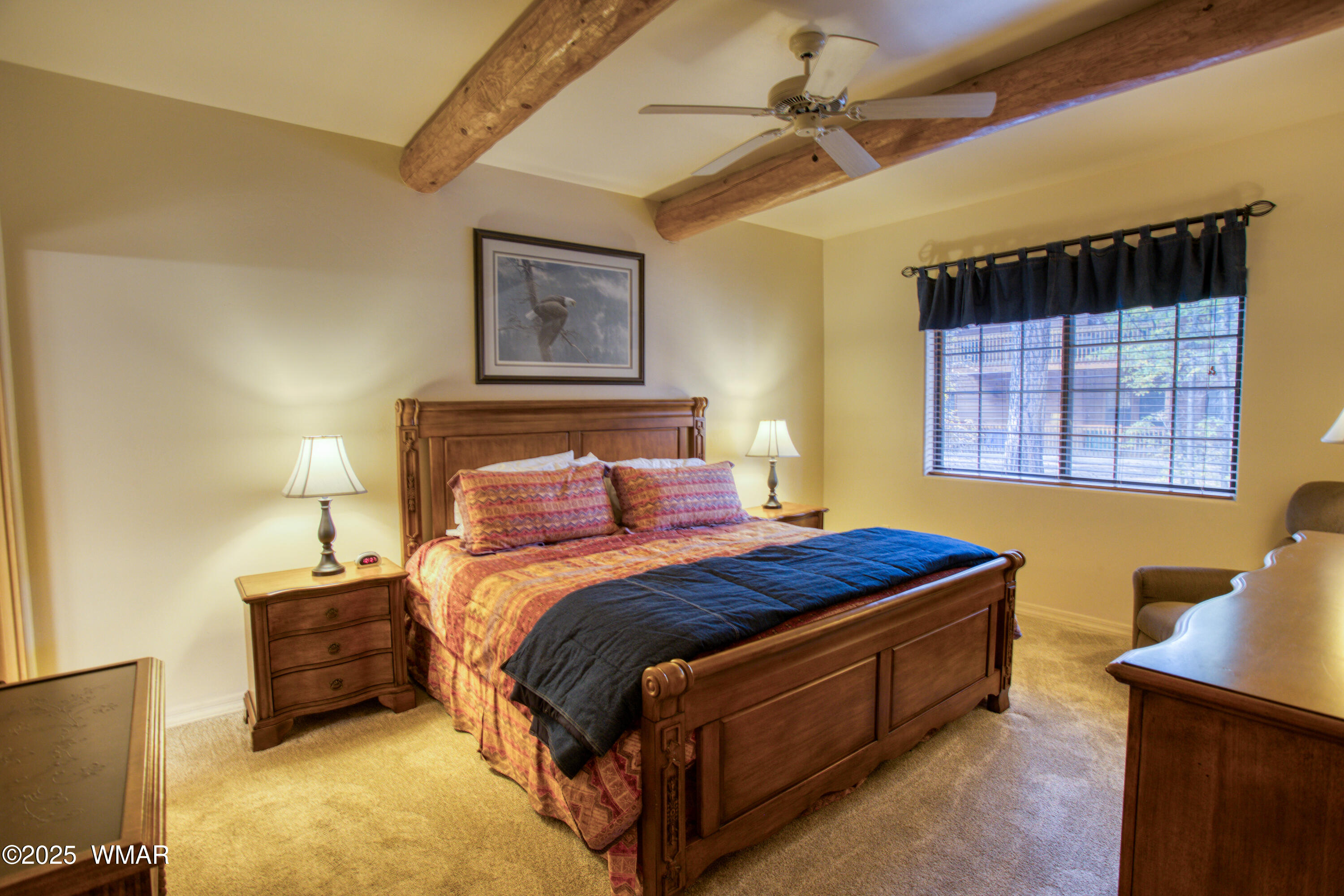 2566 Village Loop, Unit 19 Pinetop, AZ 85935 - Photo 10 of 30 a bed sitting in a bedroom next to a window