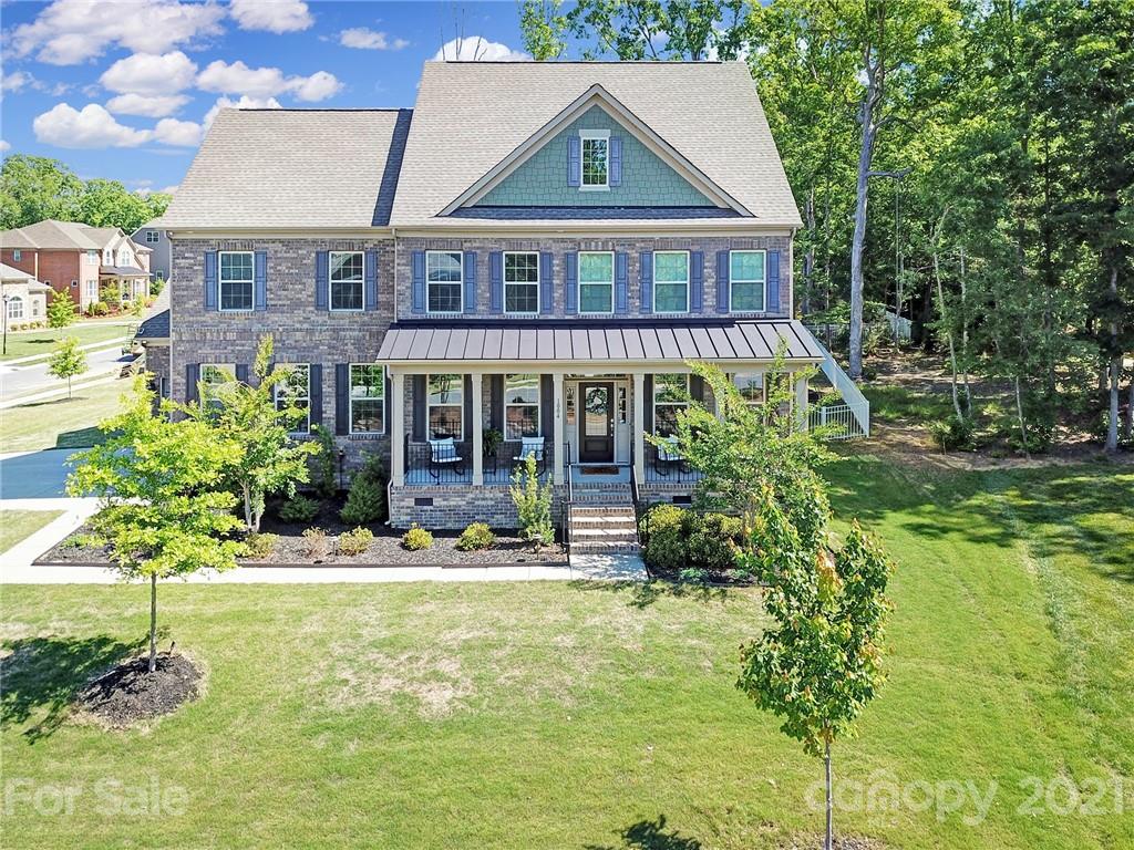 1004 Lightwood Road Waxhaw, NC 28173 - Photo 1 of 48 a front view of a house with a yard
