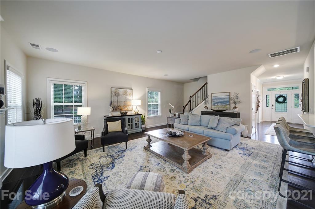 1004 Lightwood Road Waxhaw, NC 28173 - Photo 11 of 48 a living room with furniture and a wooden floor