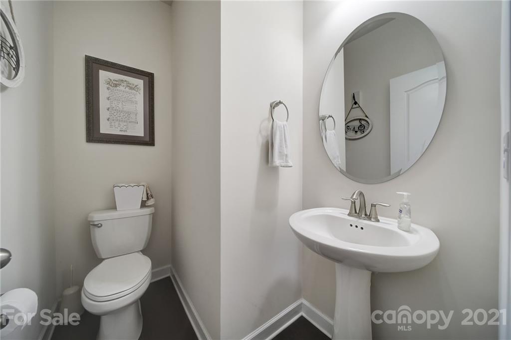 1004 Lightwood Road Waxhaw, NC 28173 - Photo 18 of 48 a bathroom with a toilet sink and mirror