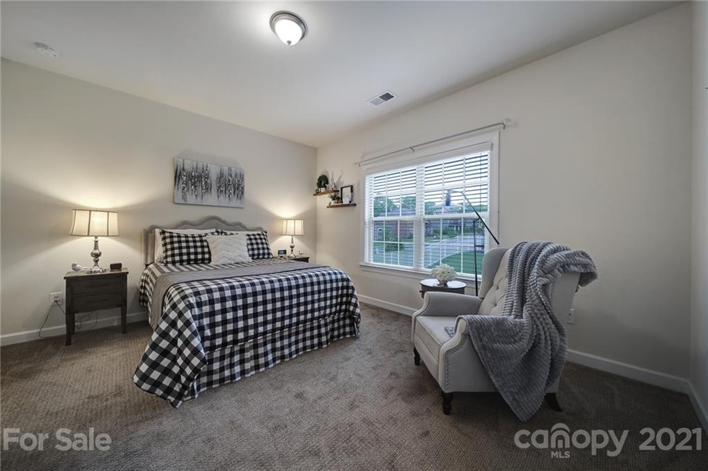 1004 Lightwood Road Waxhaw, NC 28173 - Photo 19 of 48 a bedroom with a bed and a couch