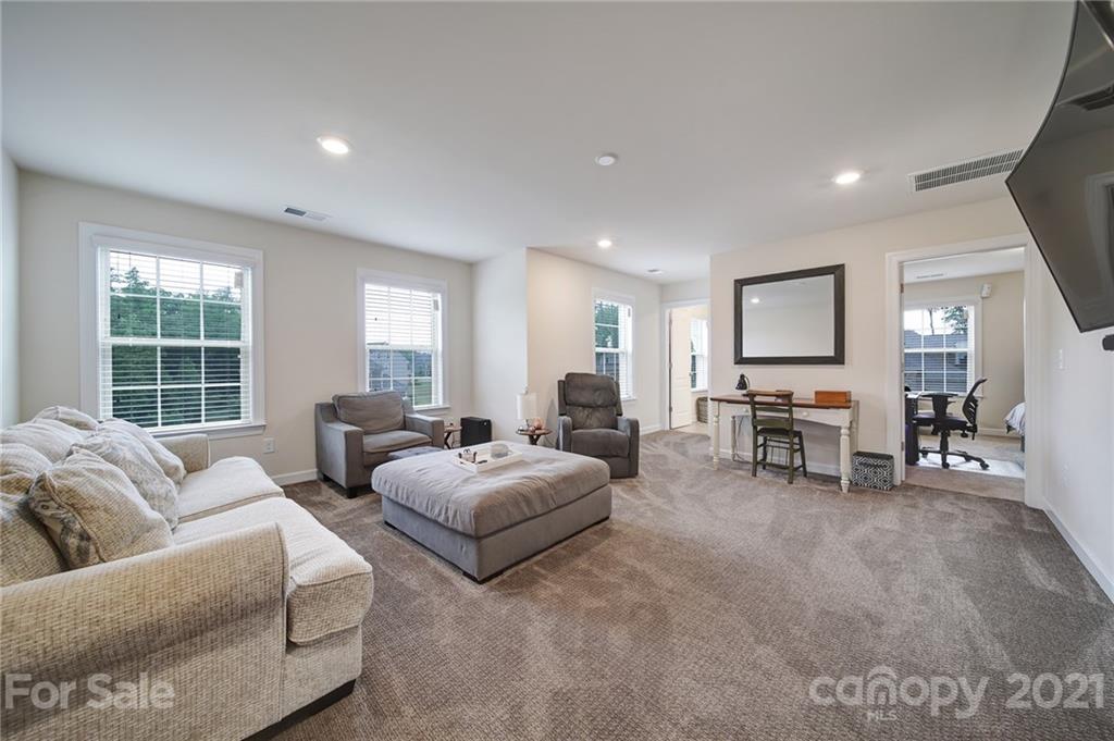 1004 Lightwood Road Waxhaw, NC 28173 - Photo 23 of 48 a living room with furniture and a window