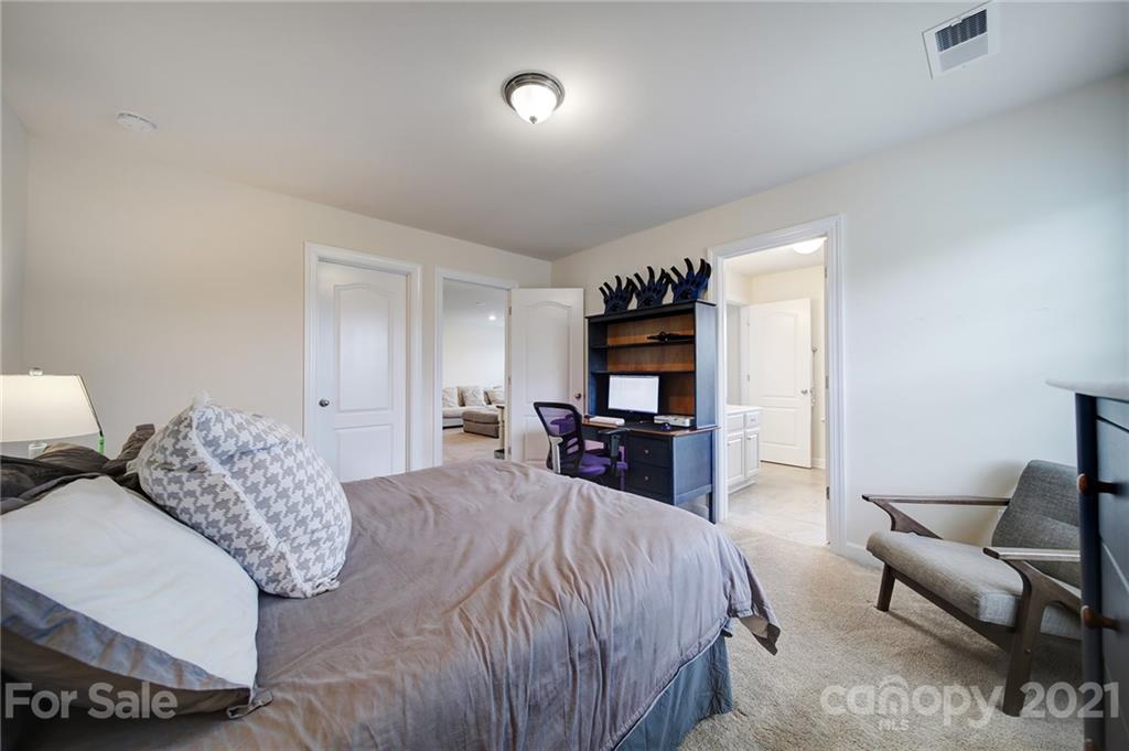 1004 Lightwood Road Waxhaw, NC 28173 - Photo 26 of 48 a bedroom with a bed and a television