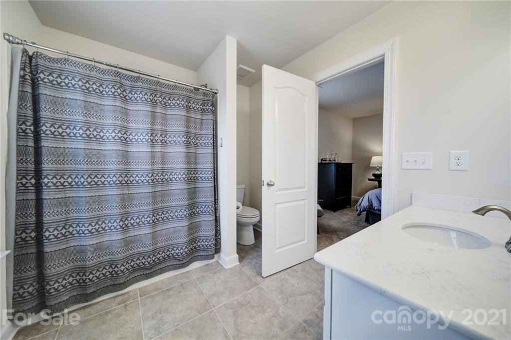 1004 Lightwood Road Waxhaw, NC 28173 - Photo 28 of 48 a bathroom with a sink and a mirror