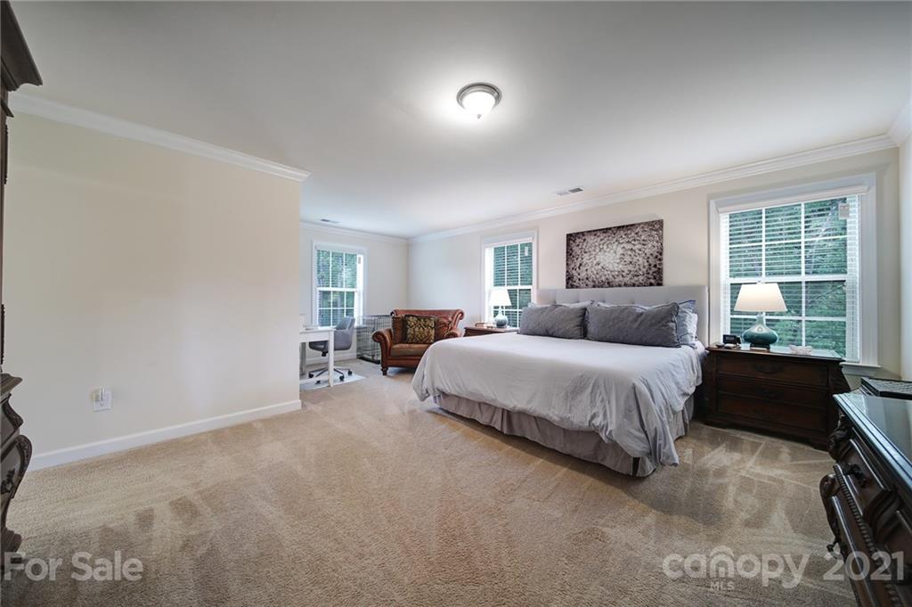 1004 Lightwood Road Waxhaw, NC 28173 - Photo 32 of 48 a spacious bedroom with a bed and a large window