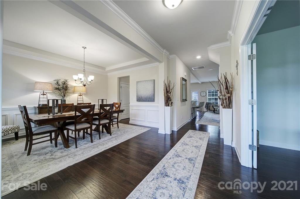 1004 Lightwood Road Waxhaw, NC 28173 - Photo 5 of 48 a view of a dining room with furniture and wooden floor