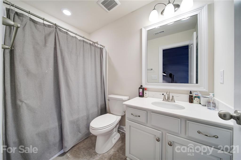 1004 Lightwood Road Waxhaw, NC 28173 - Photo 41 of 48 a bathroom with a sink a toilet and shower