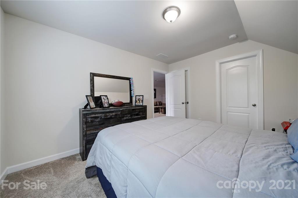 1004 Lightwood Road Waxhaw, NC 28173 - Photo 43 of 48 a bedroom with a bed and a tv