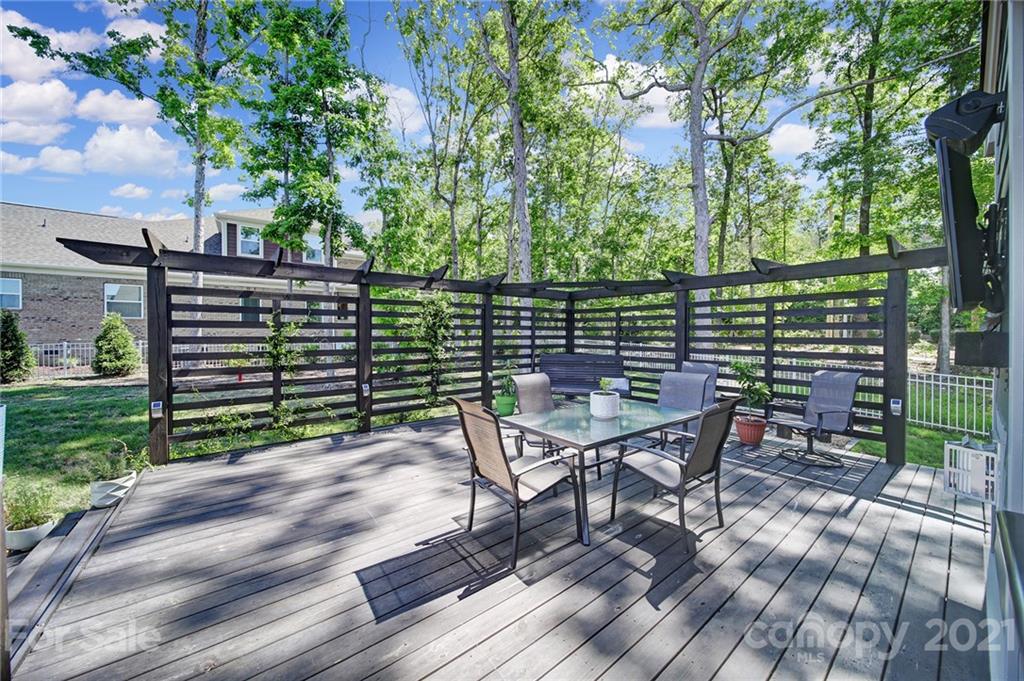 1004 Lightwood Road Waxhaw, NC 28173 - Photo 44 of 48 a view of a chairs and table on the wooden deck