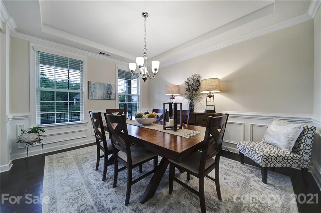 1004 Lightwood Road Waxhaw, NC 28173 - Photo 7 of 48 a view of a dining room with furniture and wooden floor