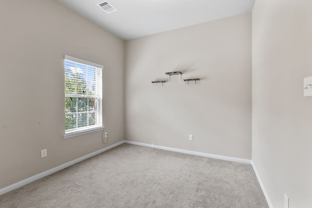 2666 Cedar Path Lane Conroe, TX 77385 - Photo 5 of 22 a view of an empty room with a window