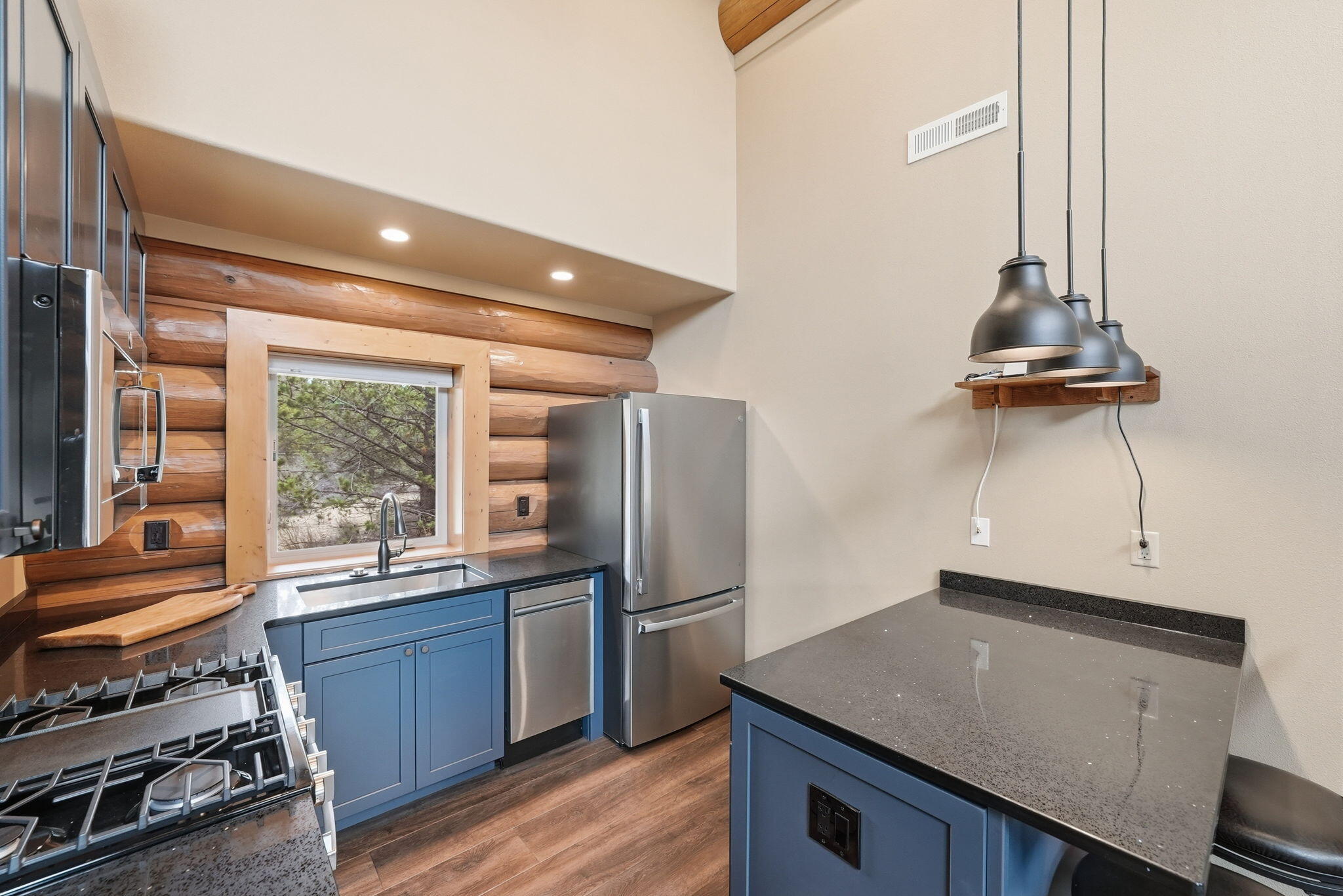 54270 Huntington Road La Pine, OR 97739 - Photo 10 of 68 a kitchen with stainless steel appliances a stove and a refrigerator